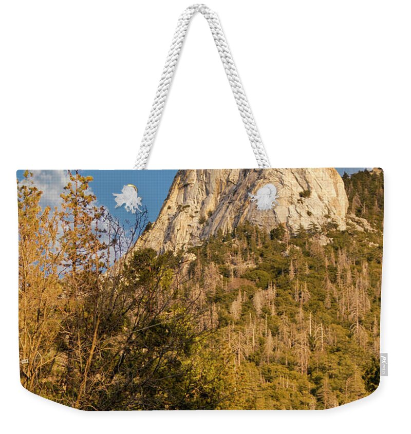 Tahquitz Weekender Tote Bag featuring the photograph A beautiful granite faced mountain top with sheer cliff and stunning landscape. by Gunther Allen