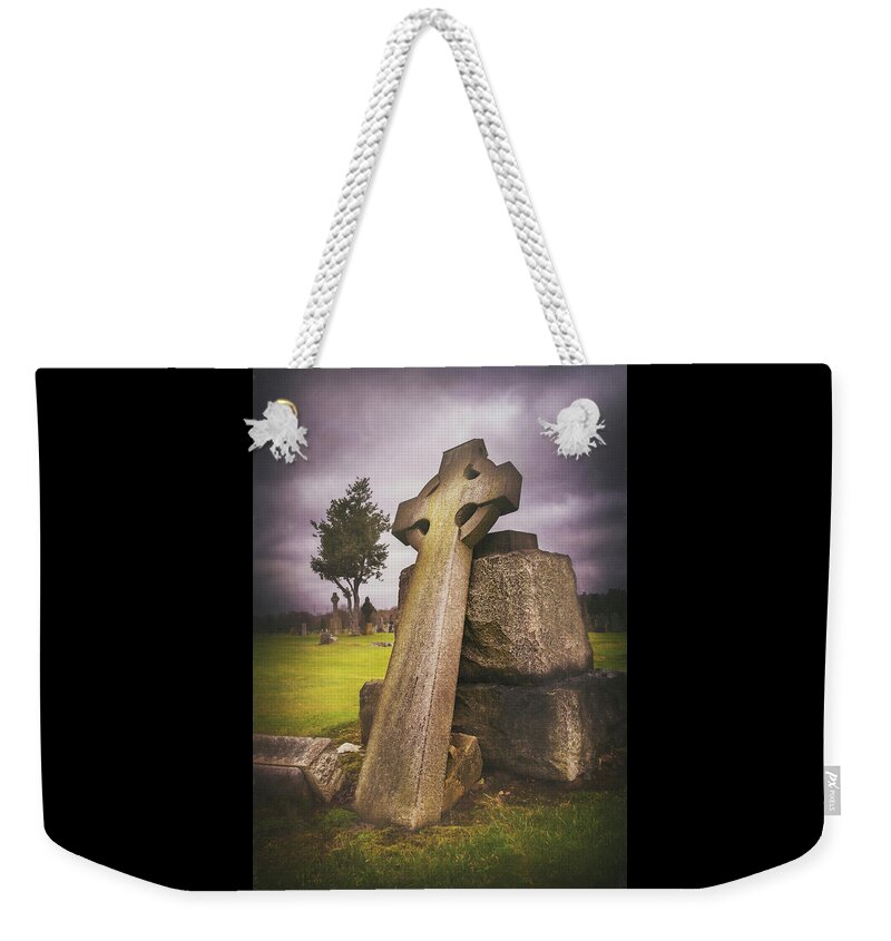 Cemetery Weekender Tote Bag featuring the photograph A Celtic Cross in Glasgow Scotland by Carol Japp