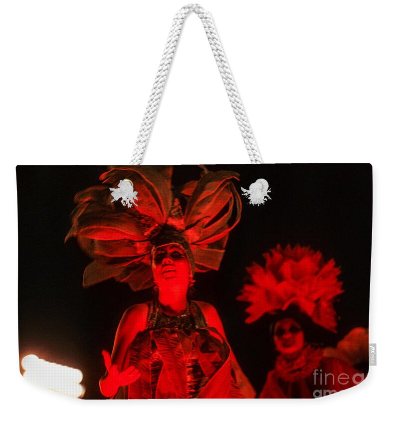 #soscuba Weekender Tote Bag featuring the mixed media A Cuban beauty dances and sings at the 1970 Havana Carnival. Red on a black background. by Elena Gantchikova