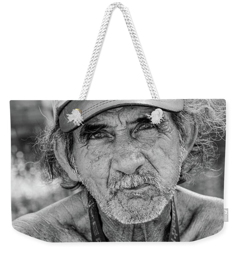 Street Weekender Tote Bag featuring the photograph A Hard Life by David Lee