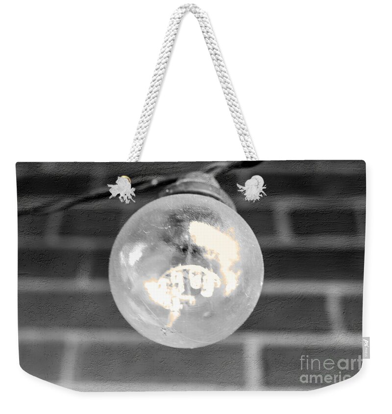Light Weekender Tote Bag featuring the photograph A light by Bentley Davis