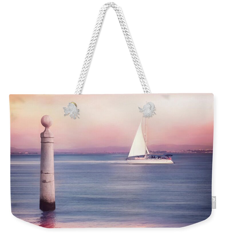 Lisbon Weekender Tote Bag featuring the photograph A Lisbon Sunset by The Tagus River by Carol Japp