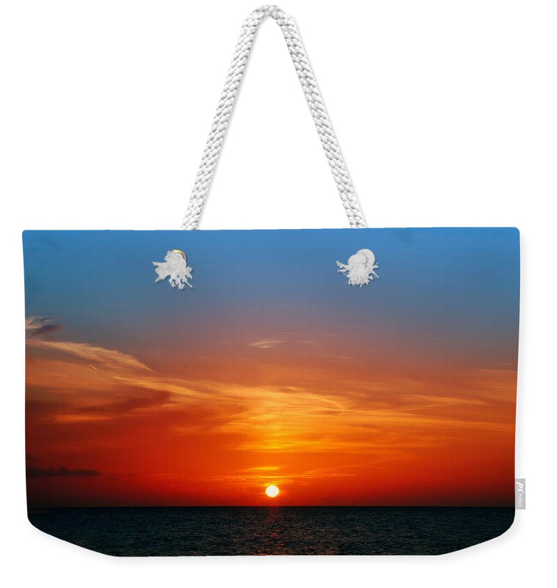 Sunset Weekender Tote Bag featuring the photograph A Little Hole in the Sky by Montez Kerr