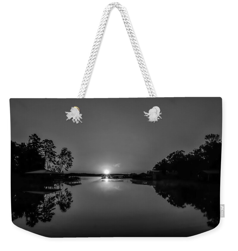 Lake Weekender Tote Bag featuring the photograph A Silhouetted Sunrise by Ed Williams