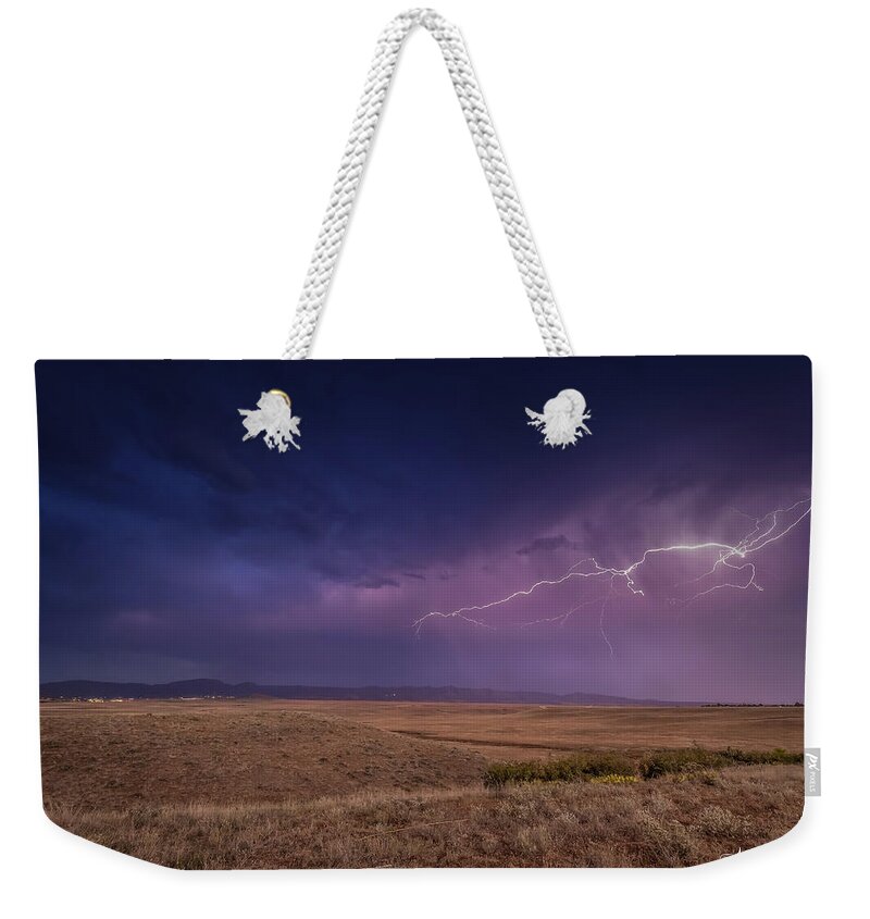 Sunset Weekender Tote Bag featuring the photograph Above the Surface by Aaron Burrows