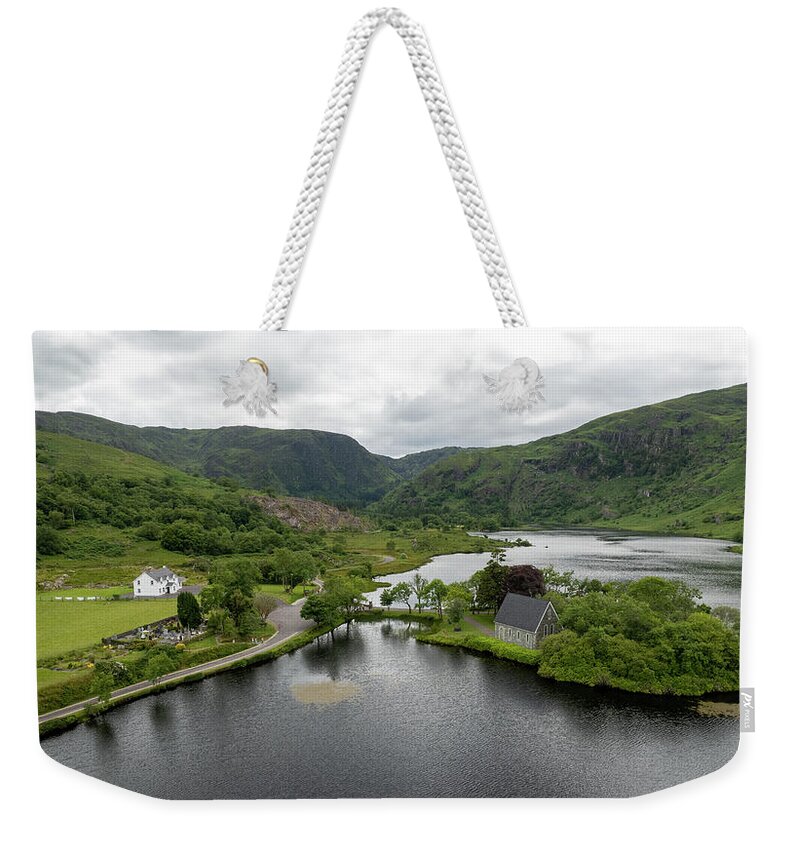 Saint Finbarr Oratory Weekender Tote Bag featuring the photograph Aerial drone landscape of St. Finbarr oratory Church, Gougane Barra, cork West Ireland. by Michalakis Ppalis