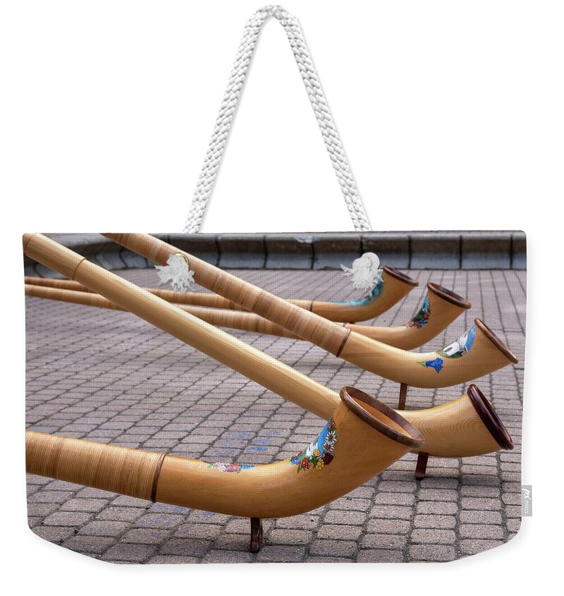 Musical Instruments Weekender Tote Bag featuring the photograph Alphorns by Nicole Zenhausern
