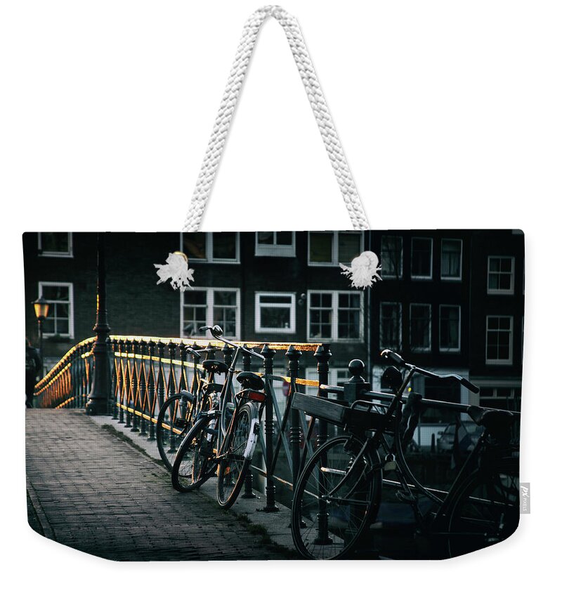 #instagram #edgalagan #galagan #edwardgalagan #nederland #netherlands #dutch #bestphotos #artgallery #artgalerie #eindhoven #boat #eduardgalagan #reflection #cityphotography #bestphotography #bestartphoto #bestartphotography #bridge #topphotography #amsterdam #church #canal #evening #town #city #autumn #architecturephotos #bike #bicycle Weekender Tote Bag featuring the digital art Amsterdam. Golden Evening. by Edward Galagan