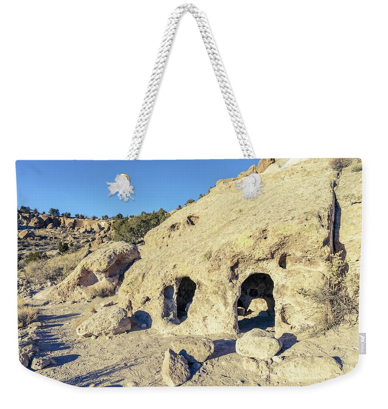 America Weekender Tote Bag featuring the photograph Ancient pueblo dwellings in Tsankawi by Alexey Stiop