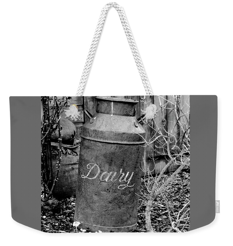 Shed Weekender Tote Bag featuring the photograph Antique vintage dairy can black and white by Severija Kirilovaite