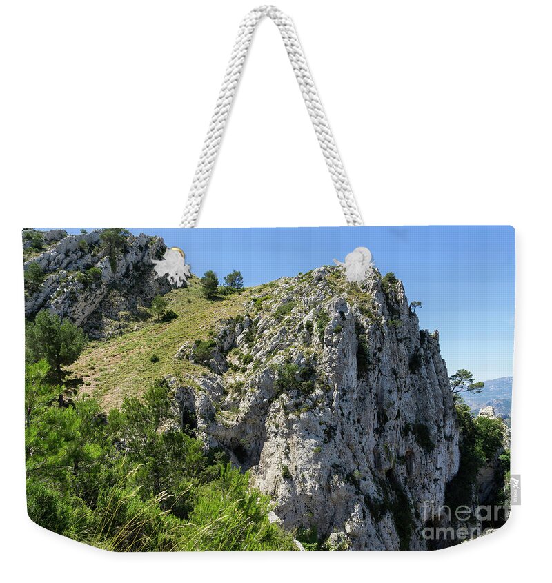 Mountains Weekender Tote Bag featuring the photograph Ascent to the ridge of the Sierra del Ferrer by Adriana Mueller