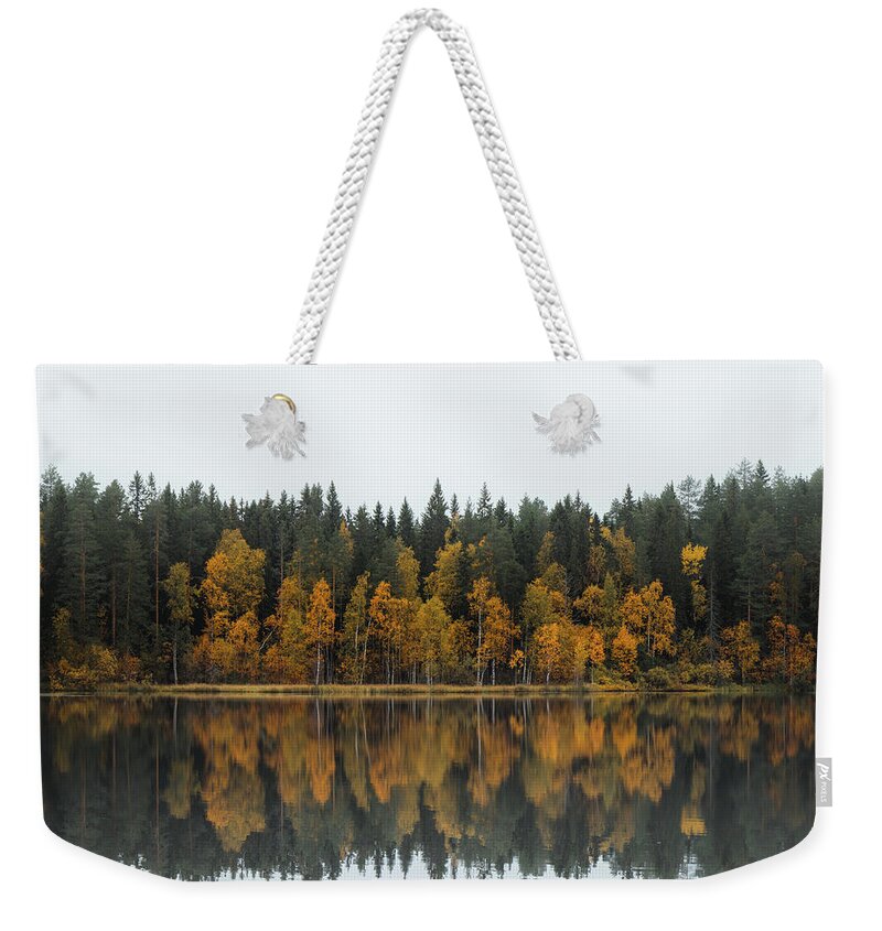 Dramatic Weekender Tote Bag featuring the photograph Autumn fairy tale in Kainuu, Finland by Vaclav Sonnek