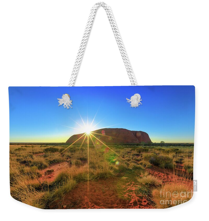 Australia Weekender Tote Bag featuring the photograph Ayers Rock at sunrise by Benny Marty