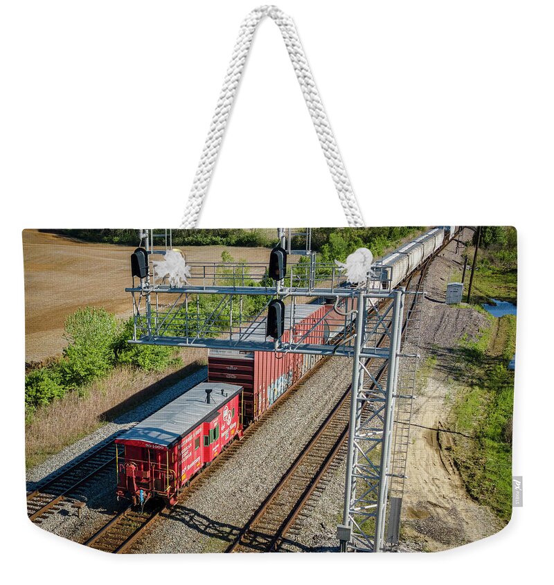 Railroad Weekender Tote Bag featuring the photograph B and O 185th Anniversary Caboose northbound at Princeton Indiana by Jim Pearson