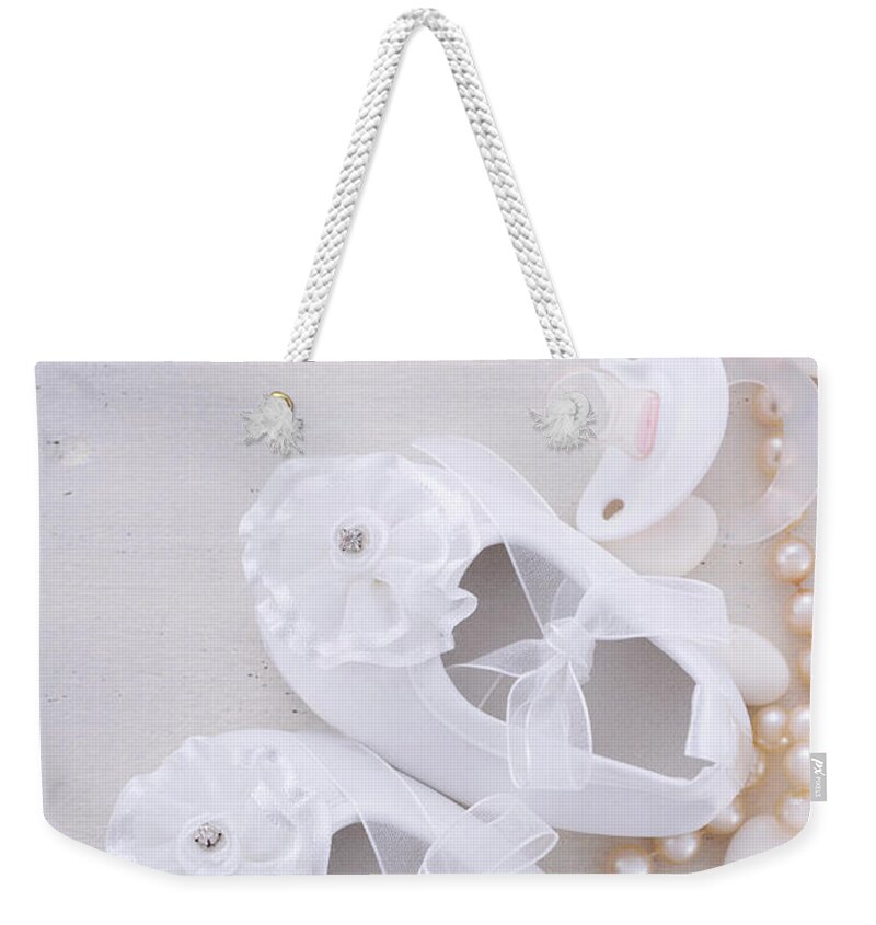 Accessories Weekender Tote Bag featuring the photograph Baby shower neutral white background. by Milleflore Images