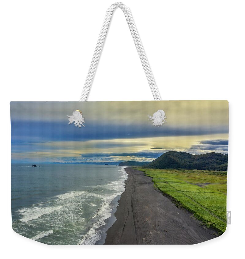 Beach Weekender Tote Bag featuring the photograph Beach with black sand on Kamchatka by Mikhail Kokhanchikov