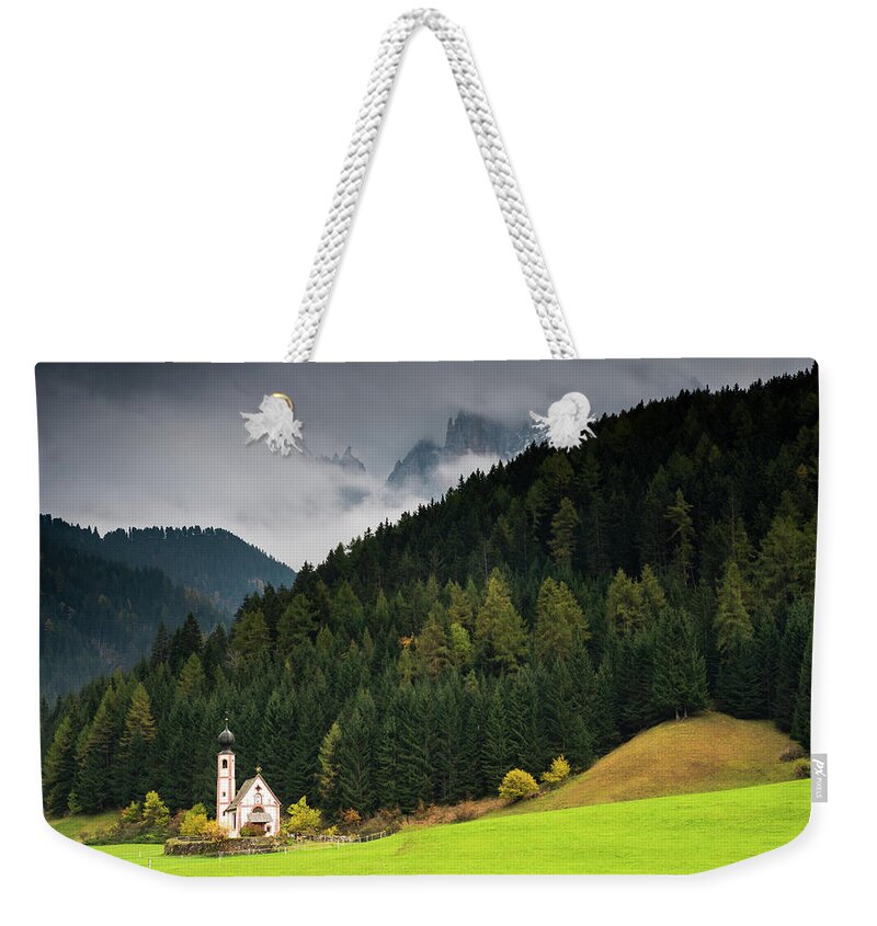 Dolomite Mountains Weekender Tote Bag featuring the photograph Beautiful small Alpine church in Italy. by Michalakis Ppalis