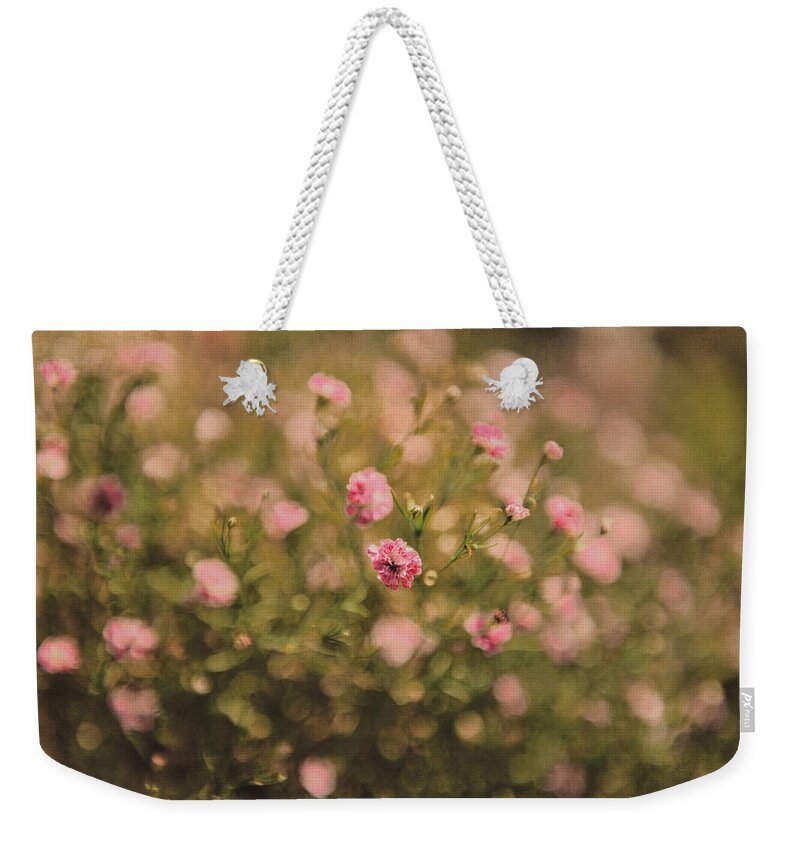  Weekender Tote Bag featuring the photograph Beauty in the garden by Yasmina Baggili