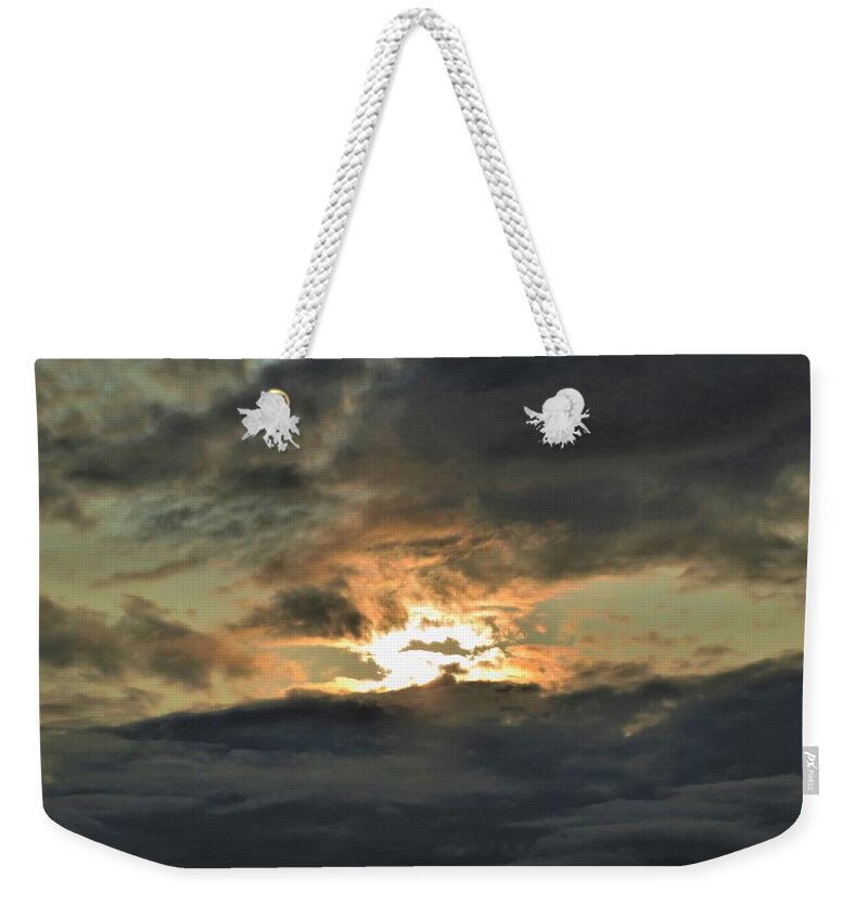 Sun Weekender Tote Bag featuring the photograph Beleaguered Sun by Ed Williams
