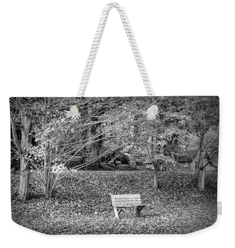 Barns Weekender Tote Bag featuring the photograph Bench in the Fallen Leaves Creeper Trail in Autumn Fall Black an by Debra and Dave Vanderlaan