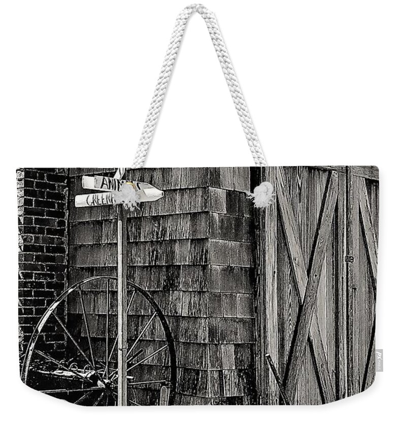  Barn Wheel Sign Dwelling Door Black White Weekender Tote Bag featuring the photograph Benner's Farm by John Linnemeyer