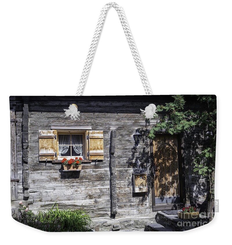 Swiss Wood Cabin Weekender Tote Bag featuring the photograph Berghuette - an original Swiss Chalet by Manuela's Camera Obscura
