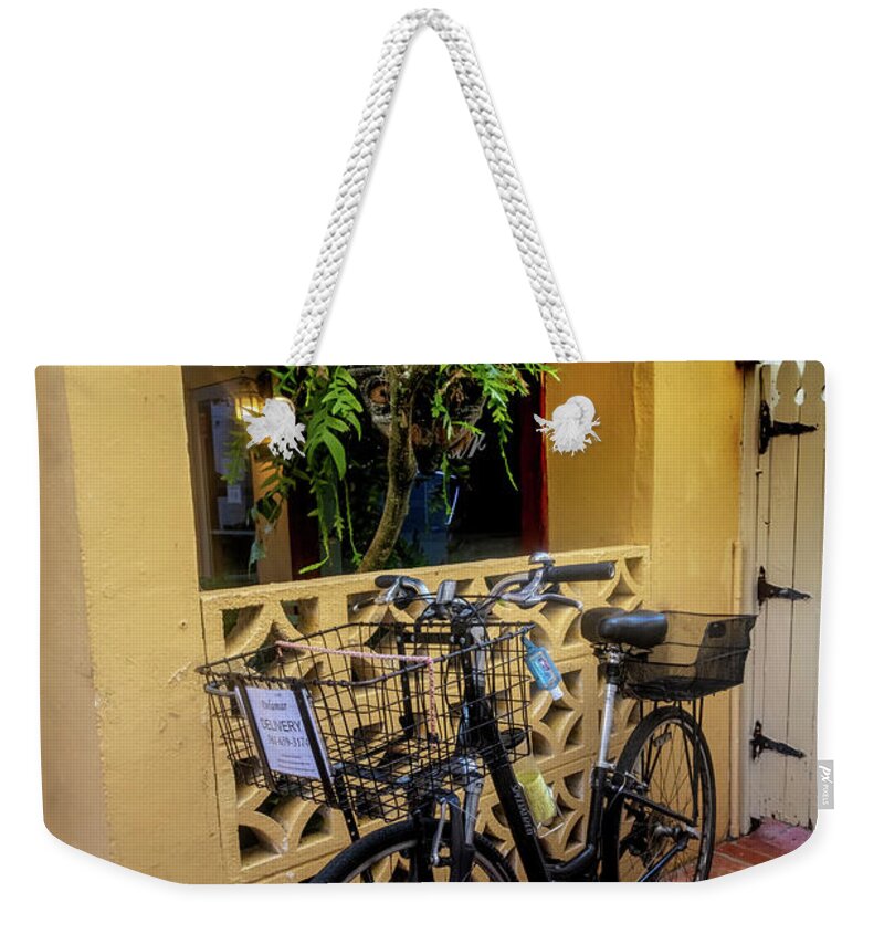 Bicycle Weekender Tote Bag featuring the photograph Bicycle in the Courtyard by Debra and Dave Vanderlaan