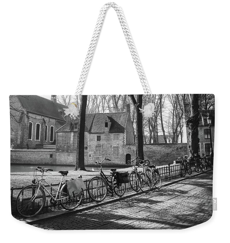 Bruges Weekender Tote Bag featuring the photograph Bicycles of Bruges Belgium Black and White by Carol Japp