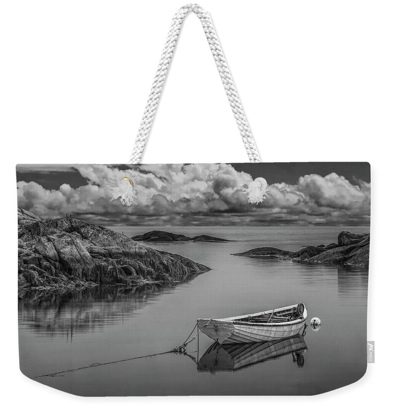 Coast Weekender Tote Bag featuring the photograph Black and White of a boat in Peggy's Cove Harbor by Randall Nyhof