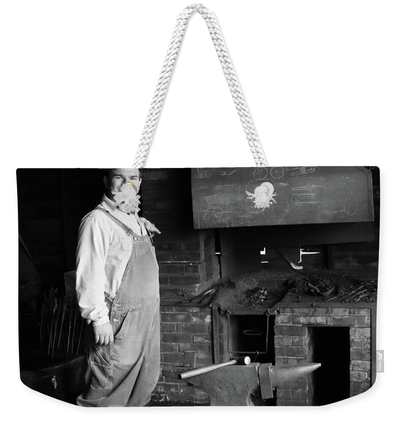 Blacksmith Weekender Tote Bag featuring the photograph Blacksmith by Lisa Mutch
