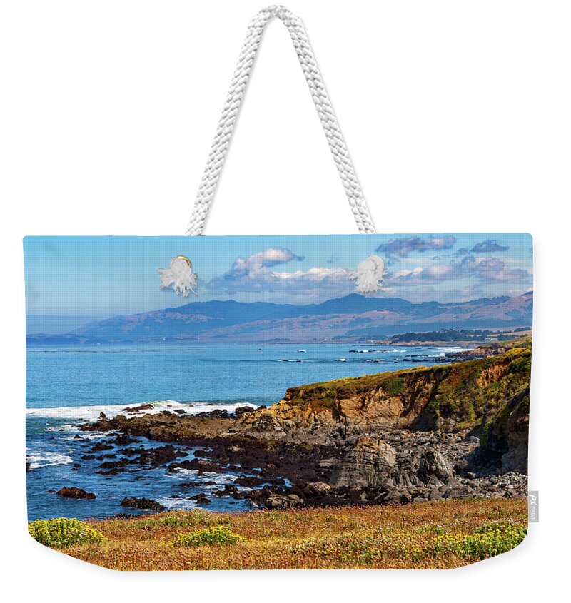 California Weekender Tote Bag featuring the photograph Blooming Cliffs by Dan Carmichael
