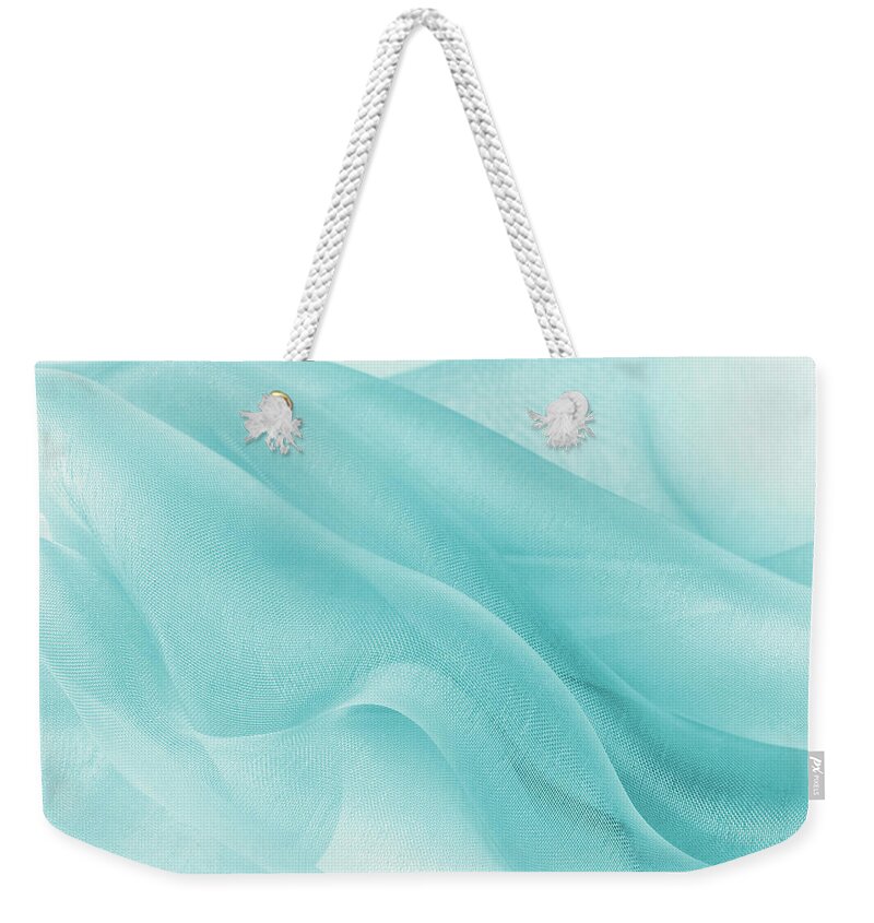 Organza Weekender Tote Bag featuring the photograph Blue abstract organza fabric in blue color by Severija Kirilovaite