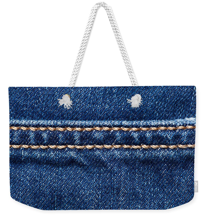 Jeans Weekender Tote Bag featuring the photograph Blue denim texture with stitch line closeup, Jeans background by Julien