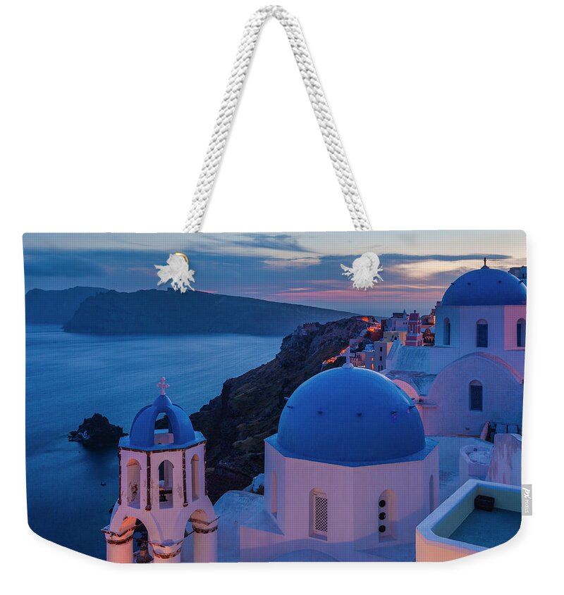 Aegean Sea Weekender Tote Bag featuring the photograph Blue Domes Of Santorini by Evgeni Dinev