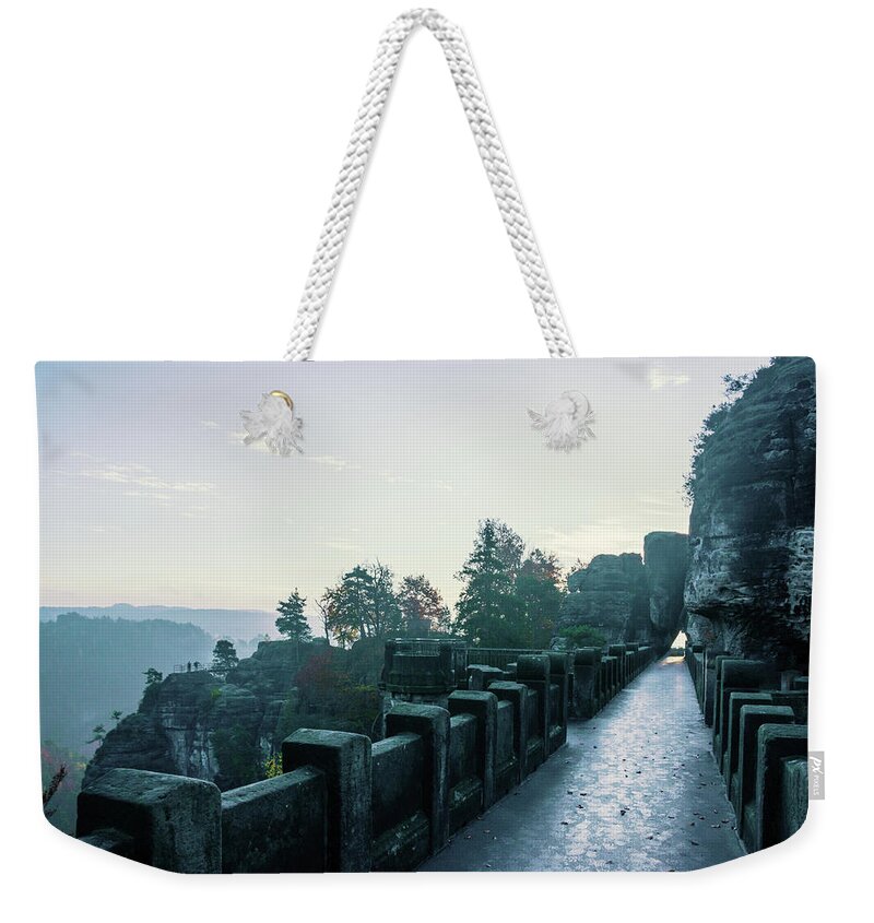 Saxon Switzerland Weekender Tote Bag featuring the photograph Blue morning on the Bastei bridge by Sun Travels
