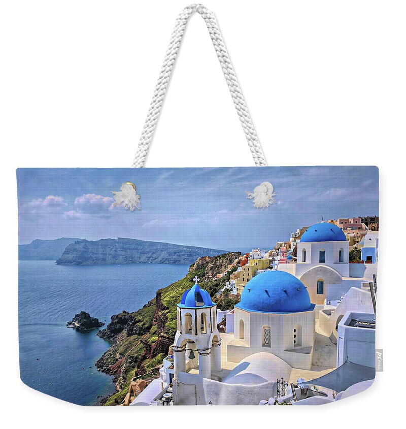 Oia Weekender Tote Bag featuring the photograph Blue Roofs of Oia Santorini by Yvonne Jasinski