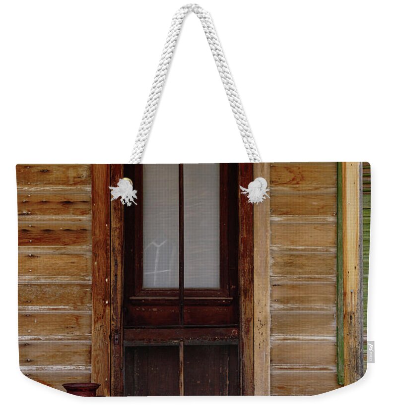 Bodie State Historic Park Weekender Tote Bag featuring the photograph Bodie Door With Milk Can by Brett Harvey