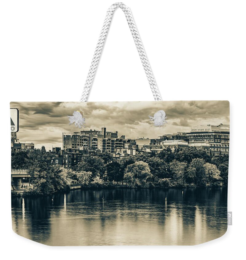 Boston Skyline Weekender Tote Bag featuring the photograph Boston's Citgo Sign Over The Charles River Panorama In Sepia by Gregory Ballos