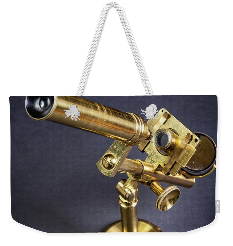 Microscope Weekender Tote Bag featuring the photograph Brass microscope by Average Images