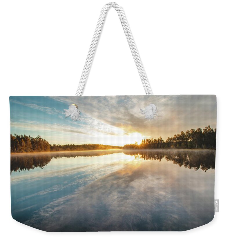 Lake Jatkonjärvi Weekender Tote Bag featuring the photograph Breathtaking sunrise at Lake Jatkonjarvi by Vaclav Sonnek