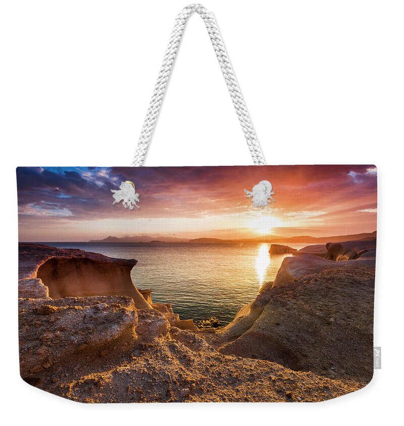 Aegean Sea Weekender Tote Bag featuring the photograph Bronze Sea Rocks by Evgeni Dinev