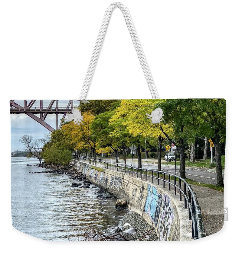 East River Weekender Tote Bag featuring the photograph By the edge of the river by Cate Franklyn