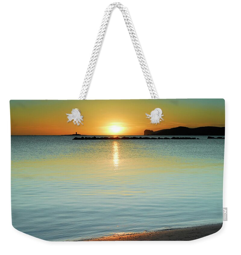 Blue Weekender Tote Bag featuring the photograph Calm sunset by Severija Kirilovaite