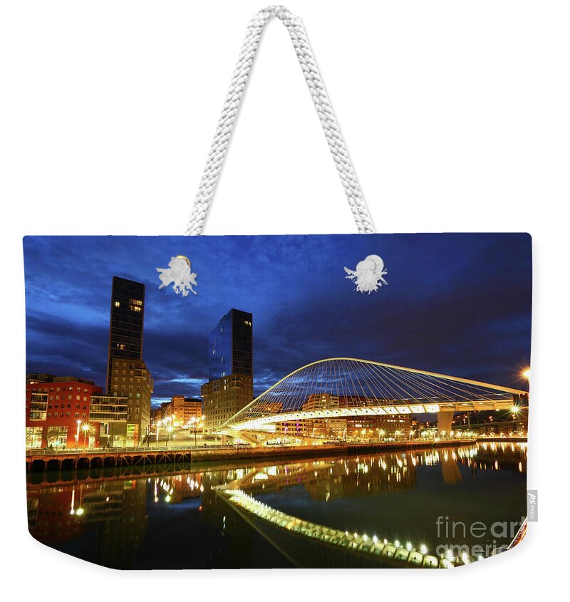 Bilbao Weekender Tote Bag featuring the photograph Campo Volantin or Zubizuri Bridge at Twilight Bilbao by James Brunker