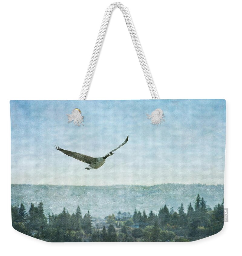 Goose Weekender Tote Bag featuring the photograph Canadian Goose Above Salmon Arm by Mary Lee Dereske