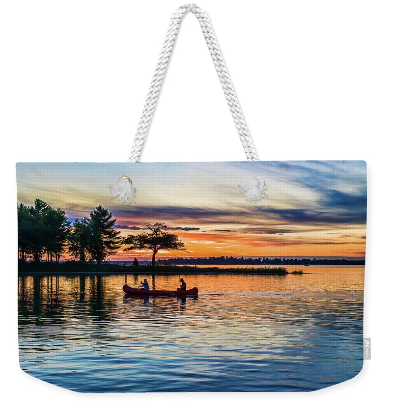 Higgins Lake Weekender Tote Bag featuring the photograph Canoe at Sunset by Joe Holley