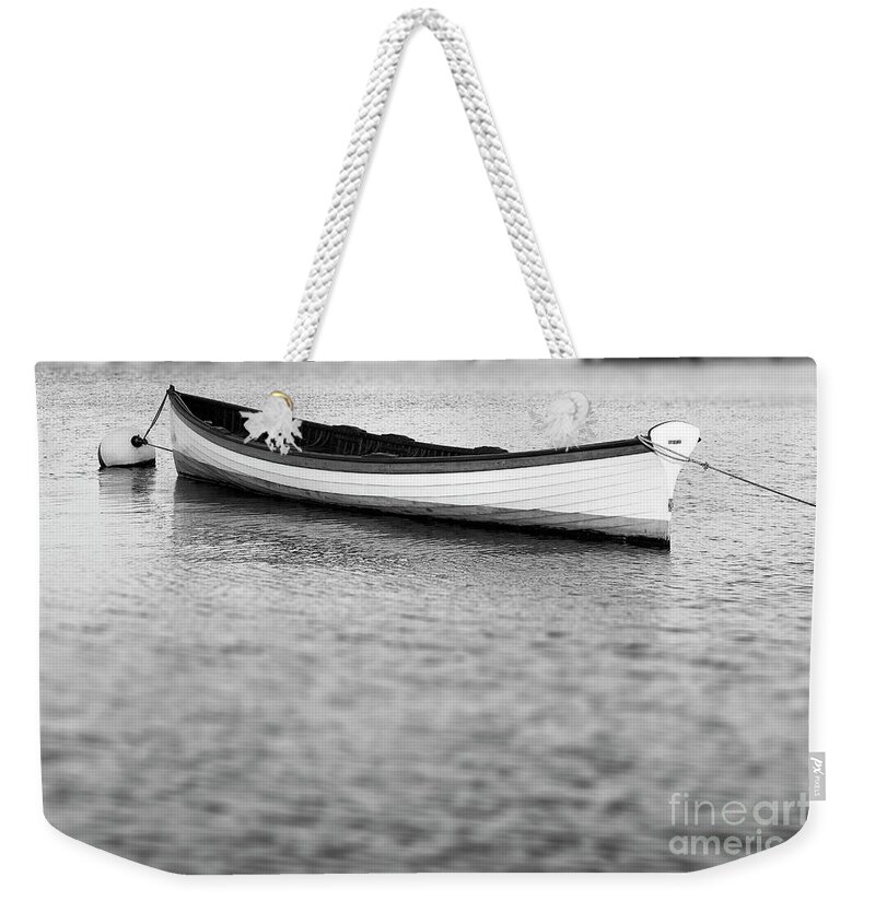 Canoe Weekender Tote Bag featuring the photograph Canoe in harbor by Tony Cordoza