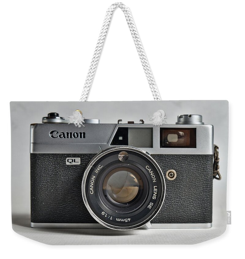 Canon Weekender Tote Bag featuring the photograph Canon analogue camera, model Canonet QL19. 35mm film Camera Front by Angelo DeVal