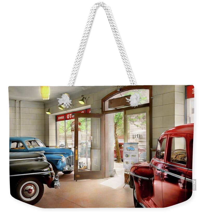 Car Weekender Tote Bag featuring the photograph Car - Dealer - Showroom finish 1942 by Mike Savad