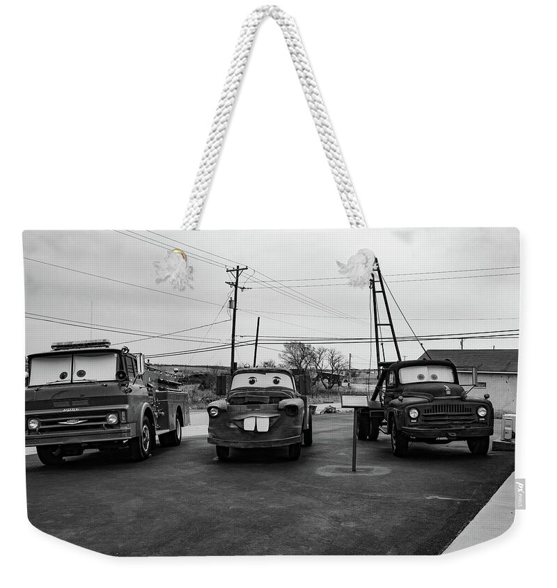 Cars On Route 66 Weekender Tote Bag featuring the photograph Cars on Route 66 in Galena Kansas in black and white by Eldon McGraw
